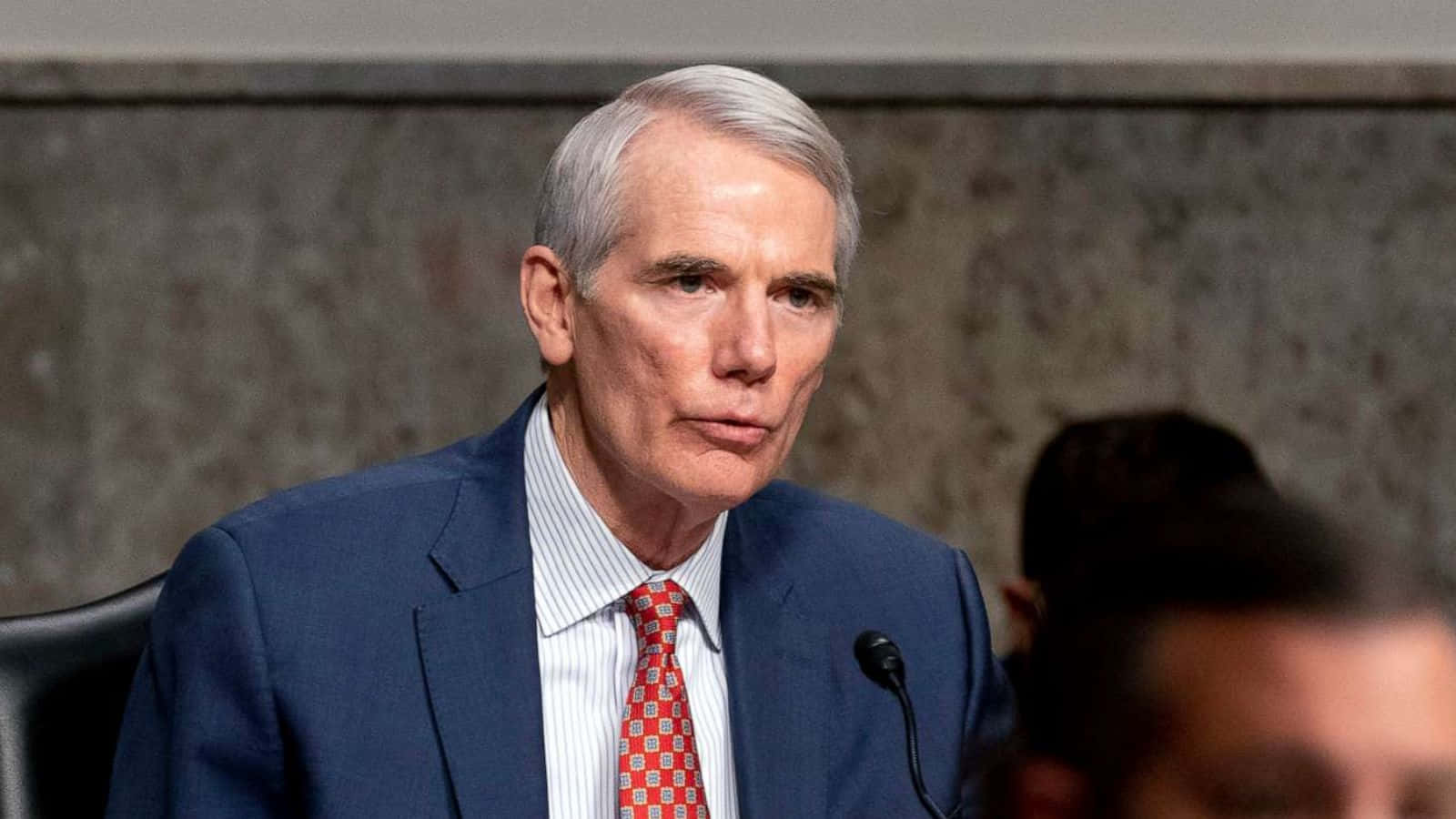 Rob Portman Engaging In Discussion Background