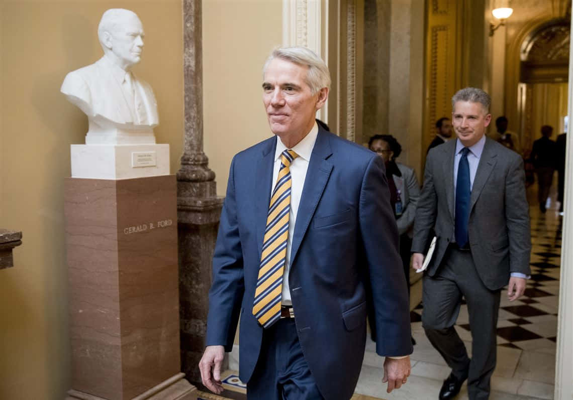 Rob Portman Walking In Hallway Background