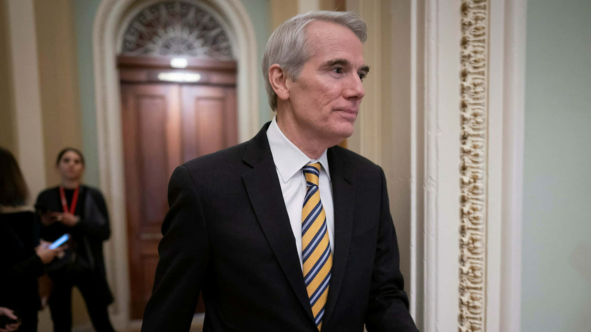 Rob Portman Walking Looking To Side Background