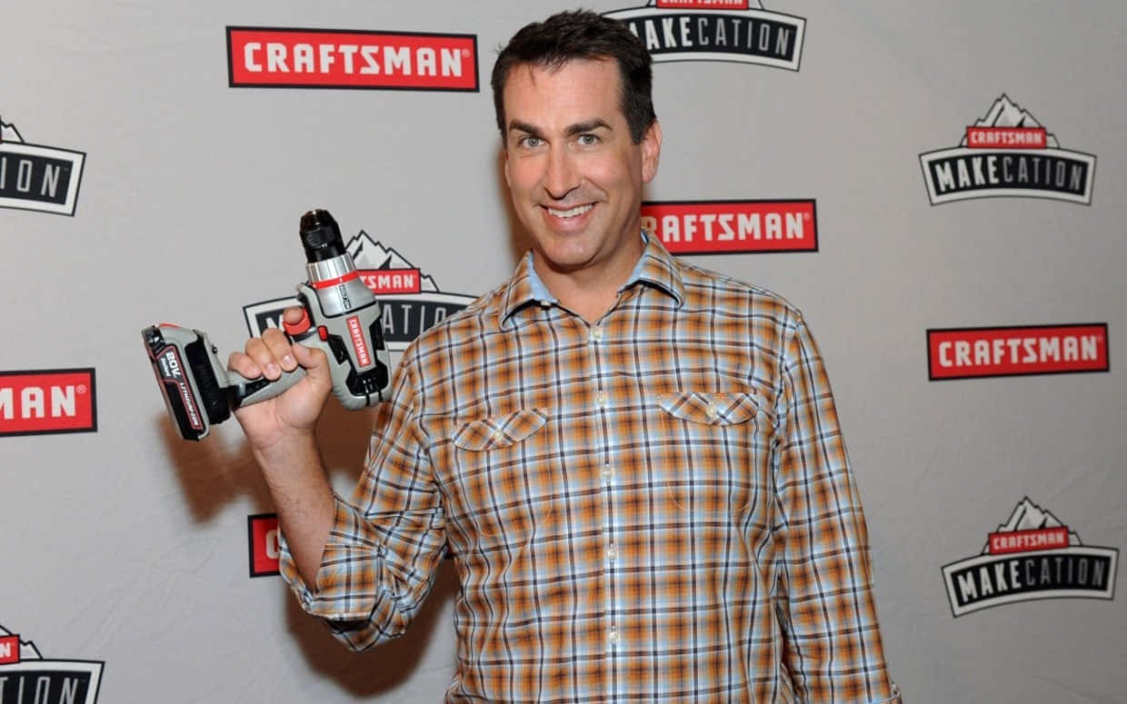 Rob Riggle At An Event, Smiling For The Camera Background
