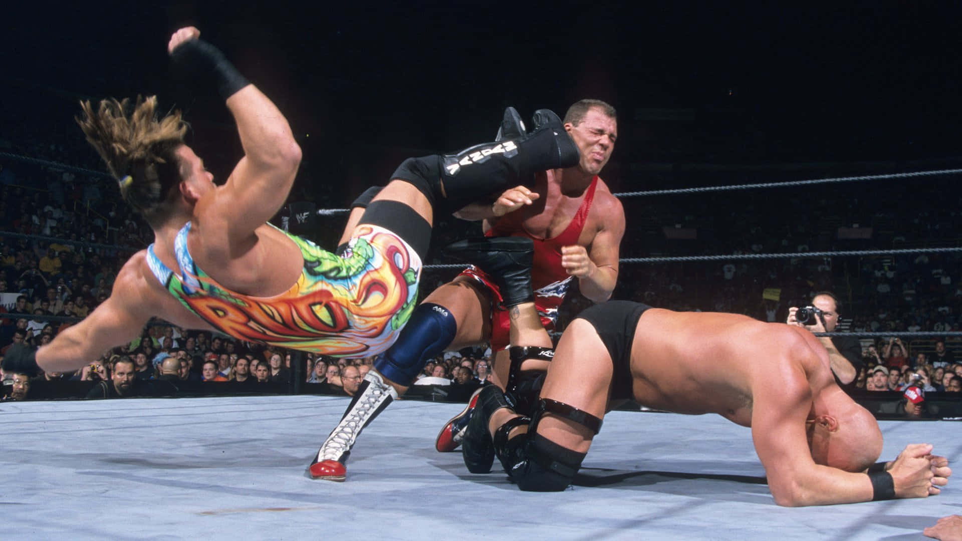 Rob Van Dam Kicking Kurt Angle Background