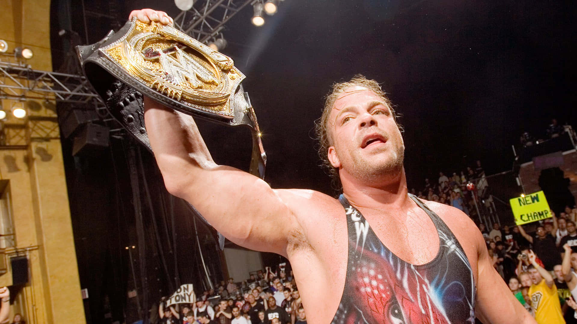 Rob Van Dam Raising Wwe Championship Belt Background