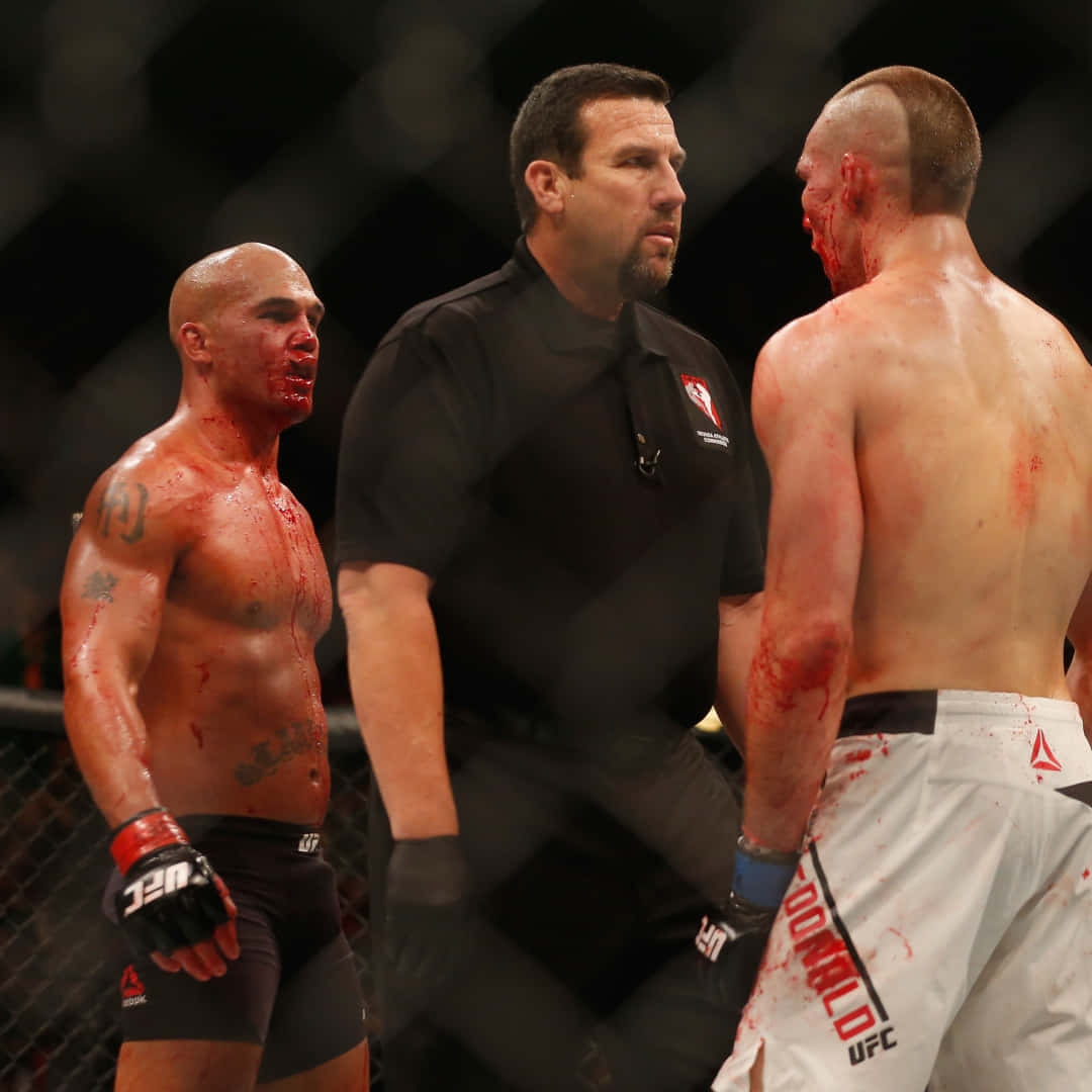 Robbie Lawler Standing Victorious Against Rory Macdonald Post Their Intense Match At Ufc 189. Background