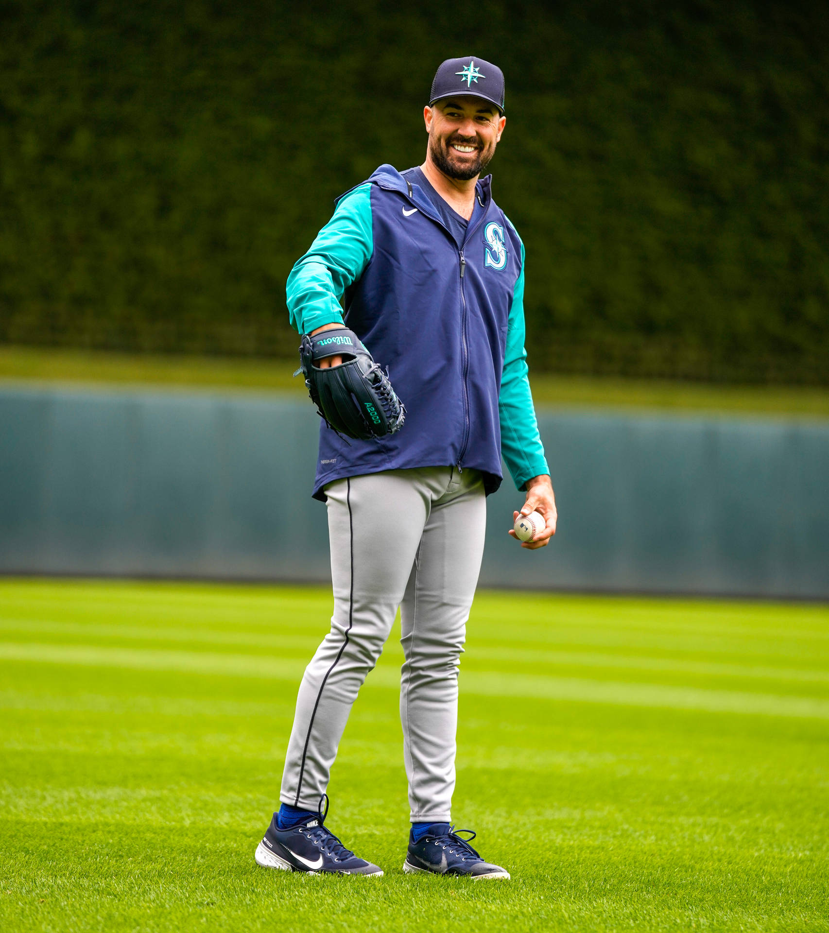 Robbie Ray Smiling In Baseball Field Background