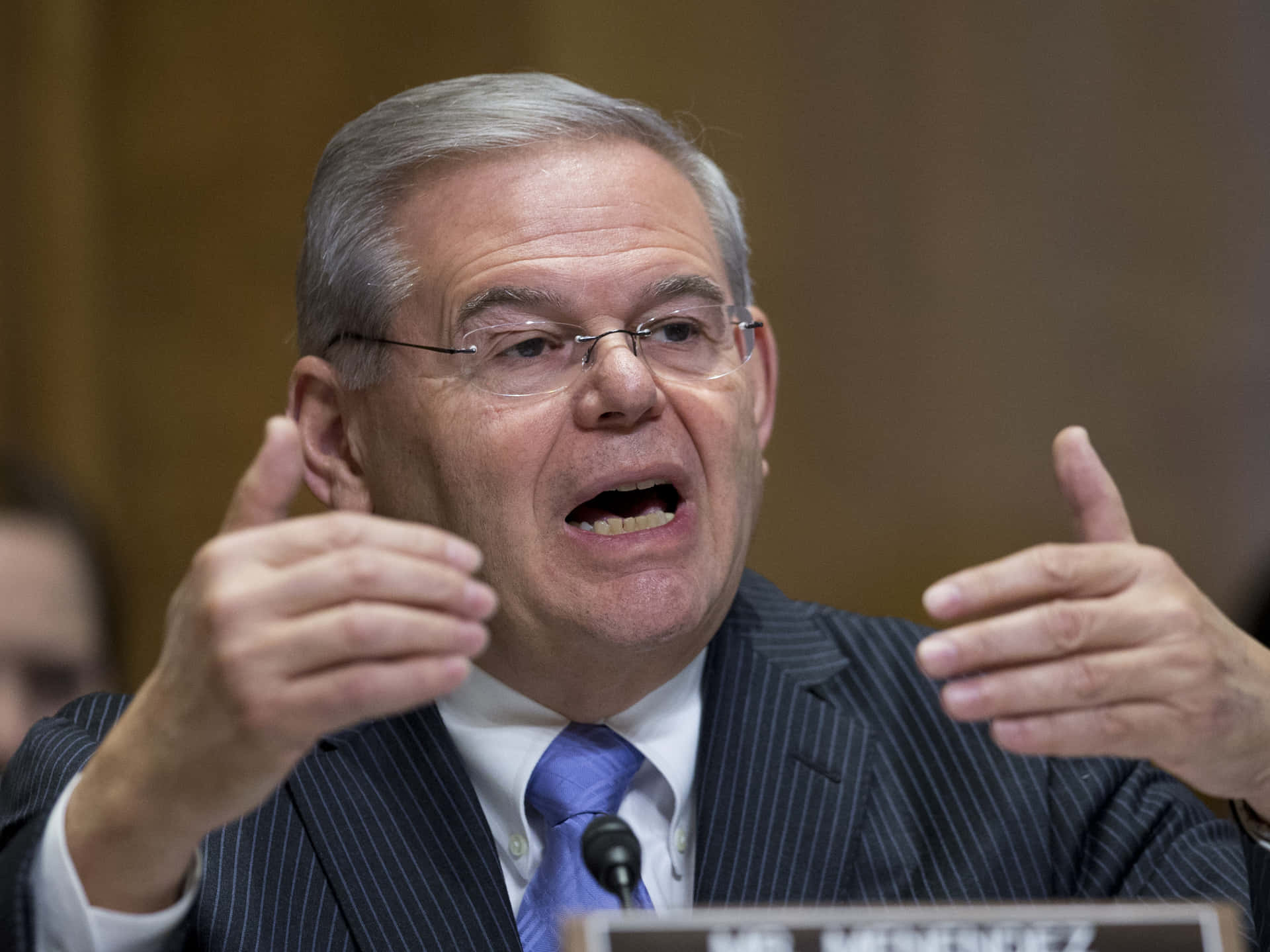 Robert Menendez Speaking Angrily Background