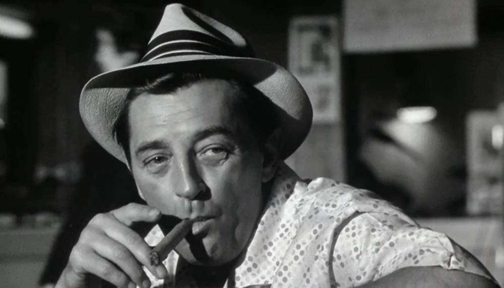 Robert Mitchum Smoking Cigars Black And White Background