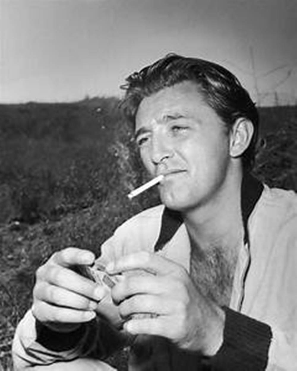 Robert Mitchum Smoking In Mountains Black And White Background