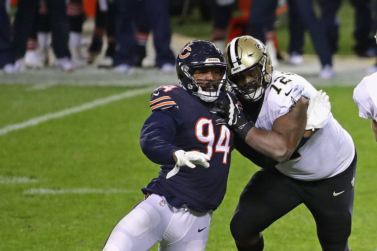Robert Quinn Tackled By Opponent Background