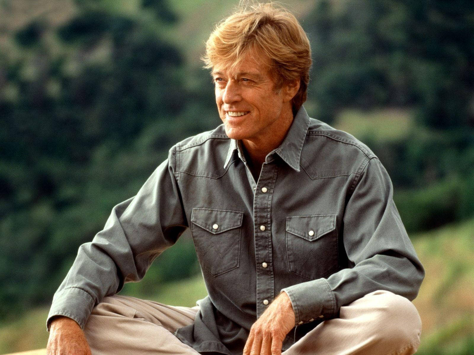 Robert Redford Smiling And Sitting