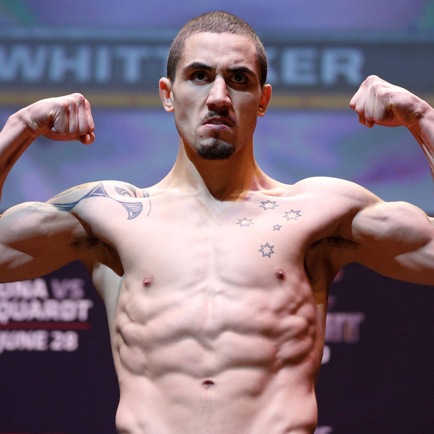 Robert Whittaker Doing Front Double Bicep Pose