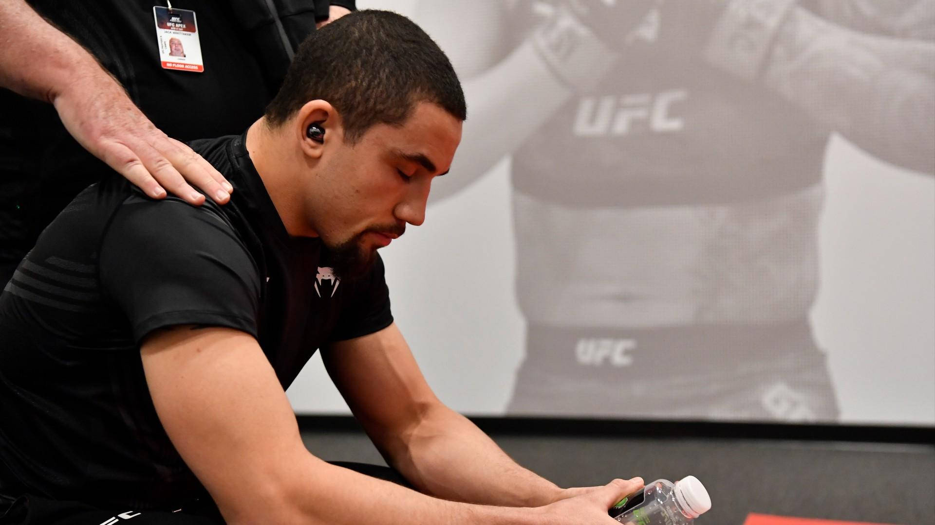 Robert Whittaker Sitting With Eyes Closed Background