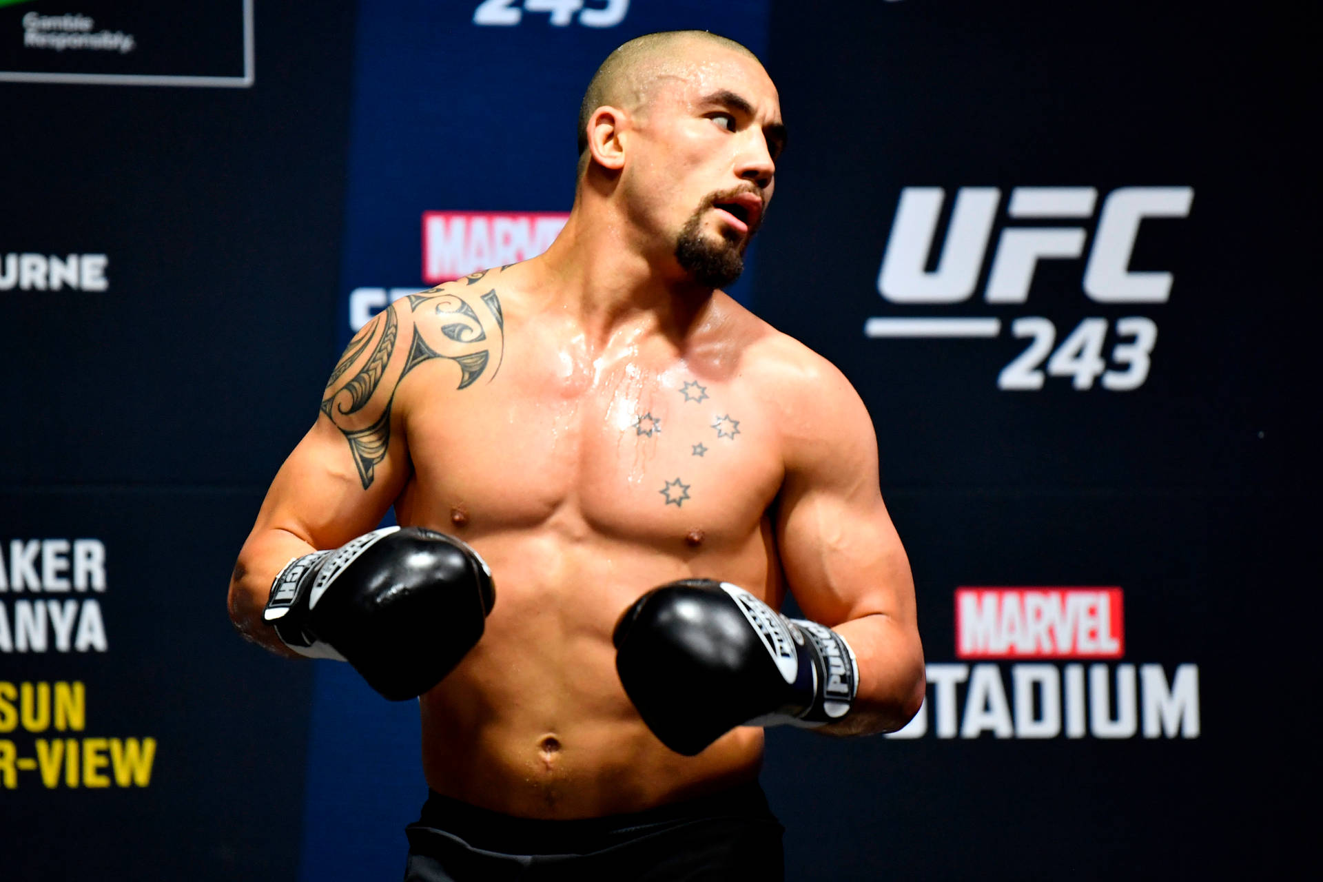 Robert Whittaker With Boxing Gloves Background