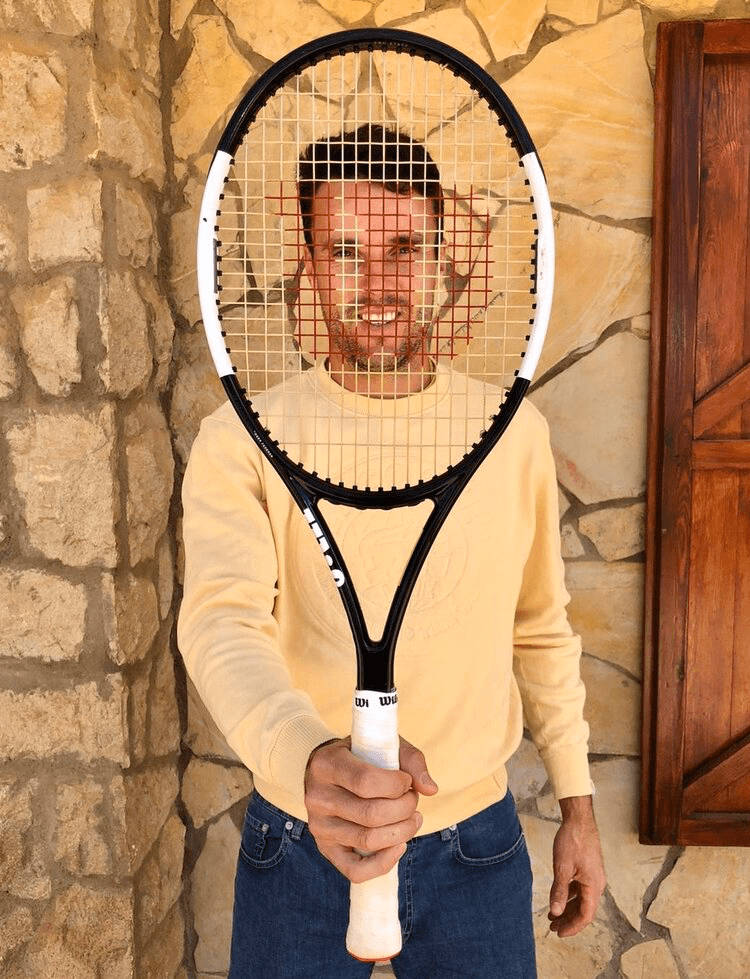 Roberto Bautista Agut Behind Tennis Racket Background