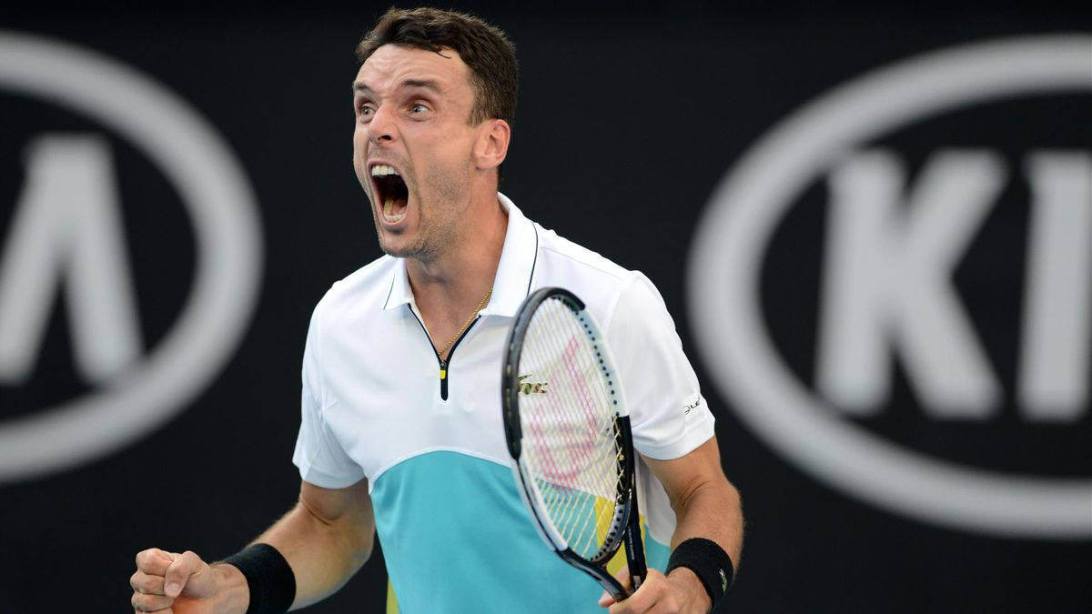 Roberto Bautista Agut In Action On The Tennis Court Background