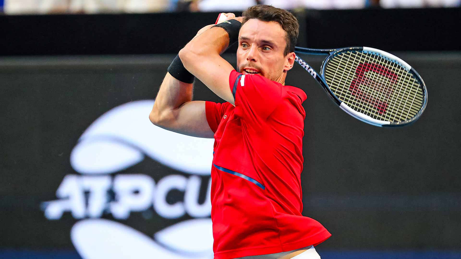 Roberto Bautista Agut Wearing His Iconic Red Jersey During A Tennis Match.