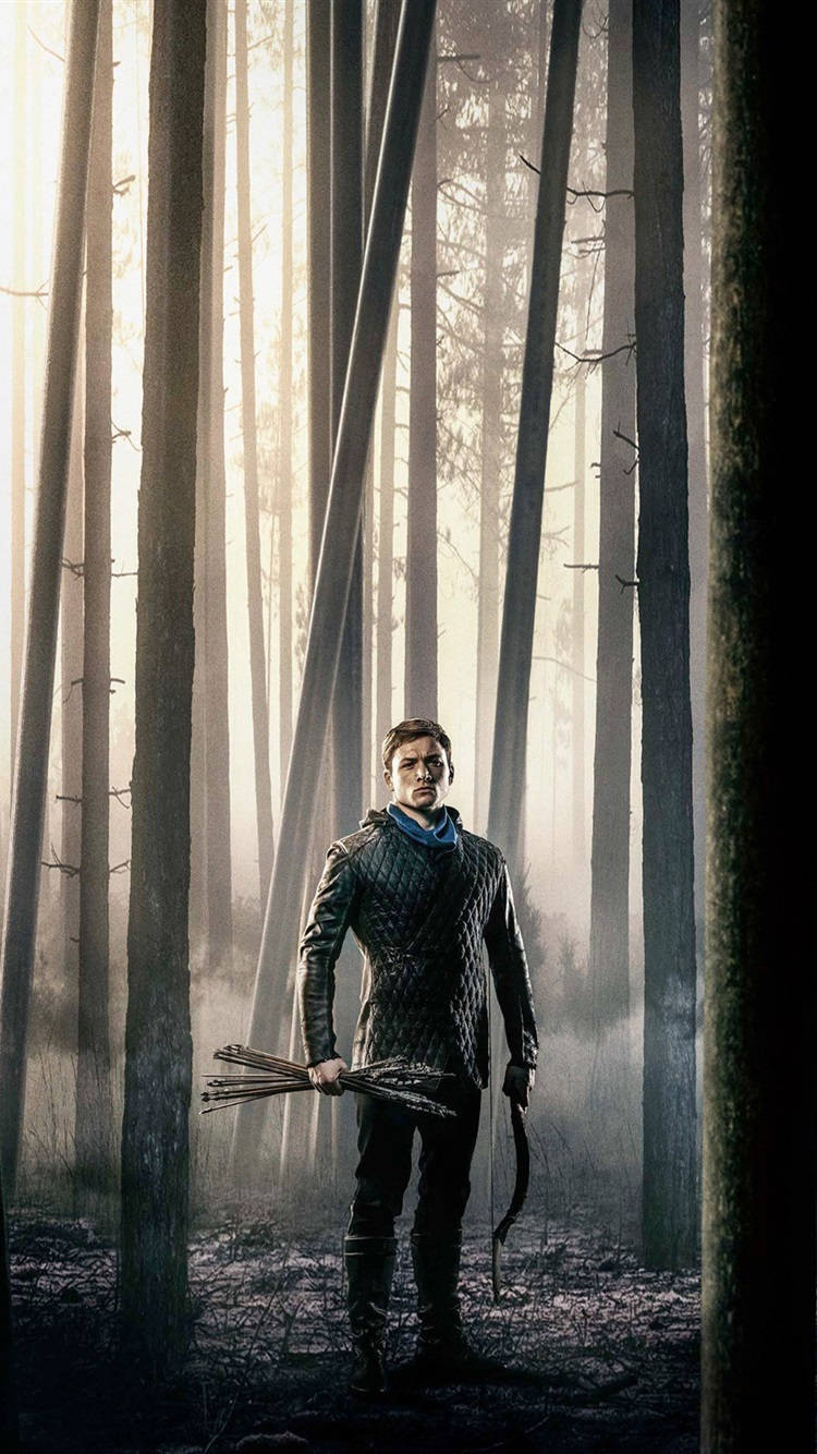 Robin Hood 2018 Standing In Forest Background