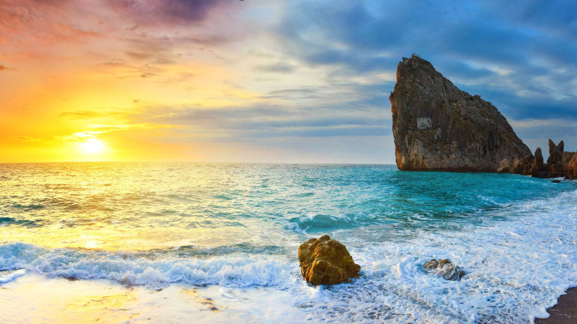 Rock Formation On Blue Beach Sunrise Background