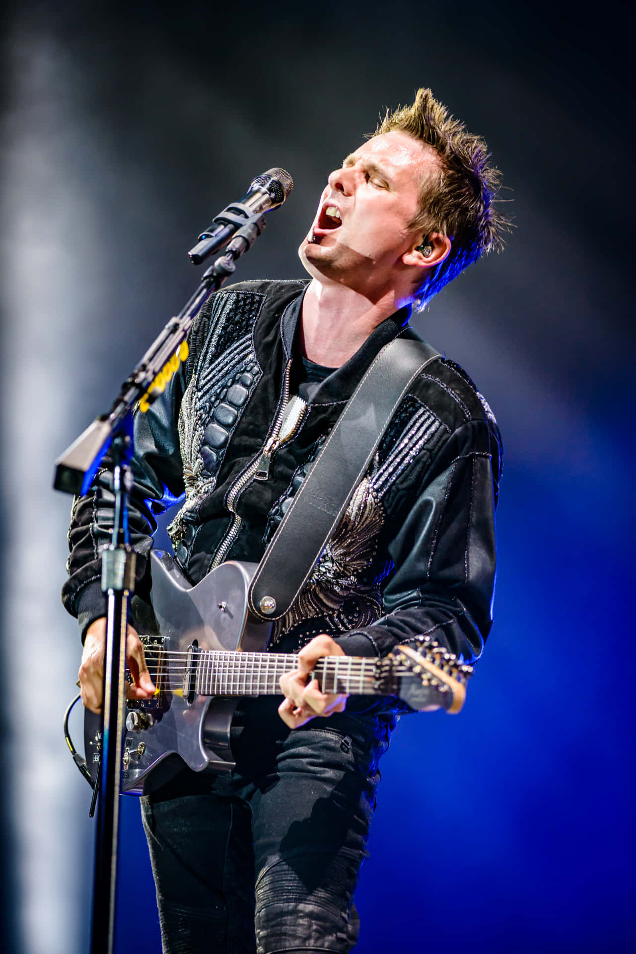 Rock Guitarist Singing Passionately Live Concert