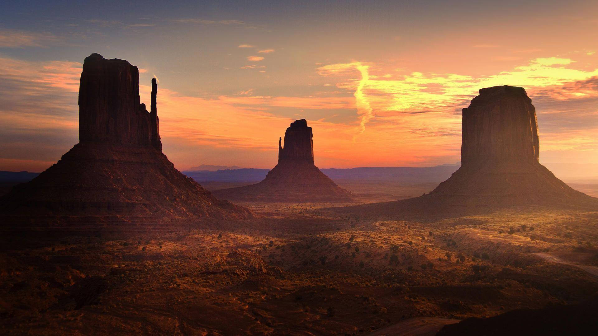 Rock Silhouette At Monument Valley Background