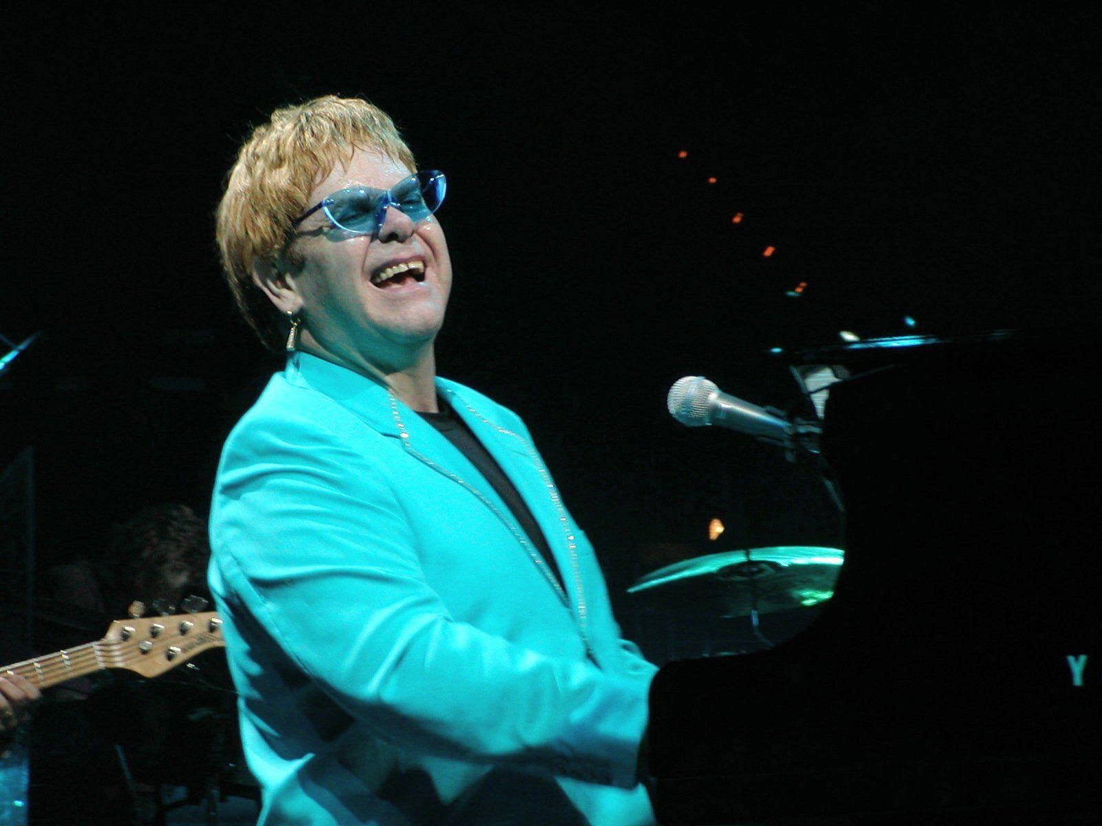 Rocketman Laughing On Live Performance Background