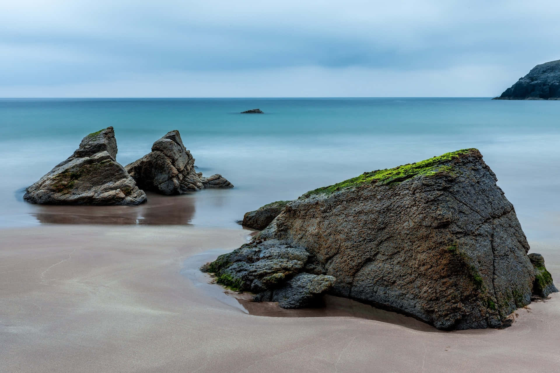 Rocks Formation Sand Ocean Water Background