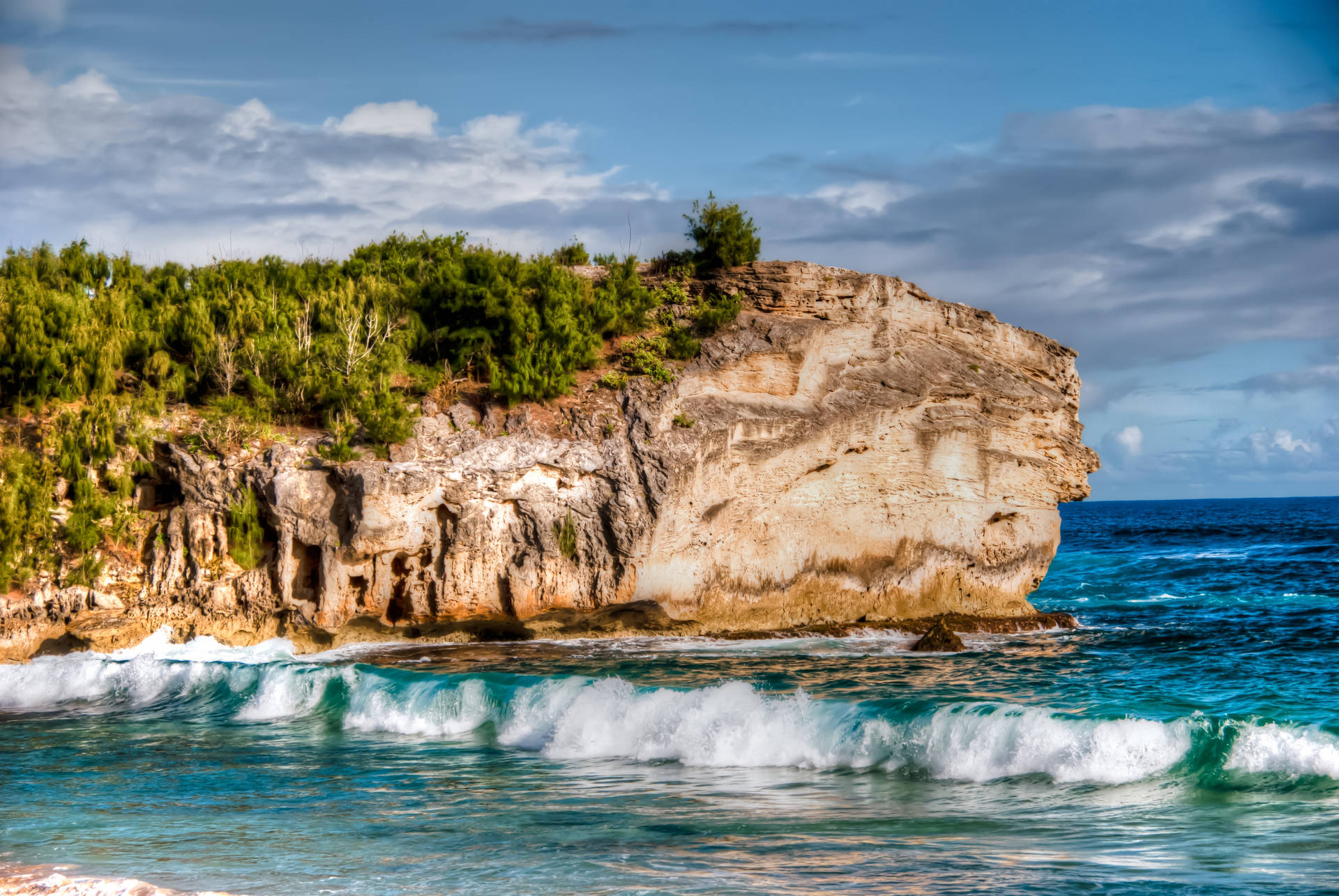 Rocky Cliff And Sandy Beach Background