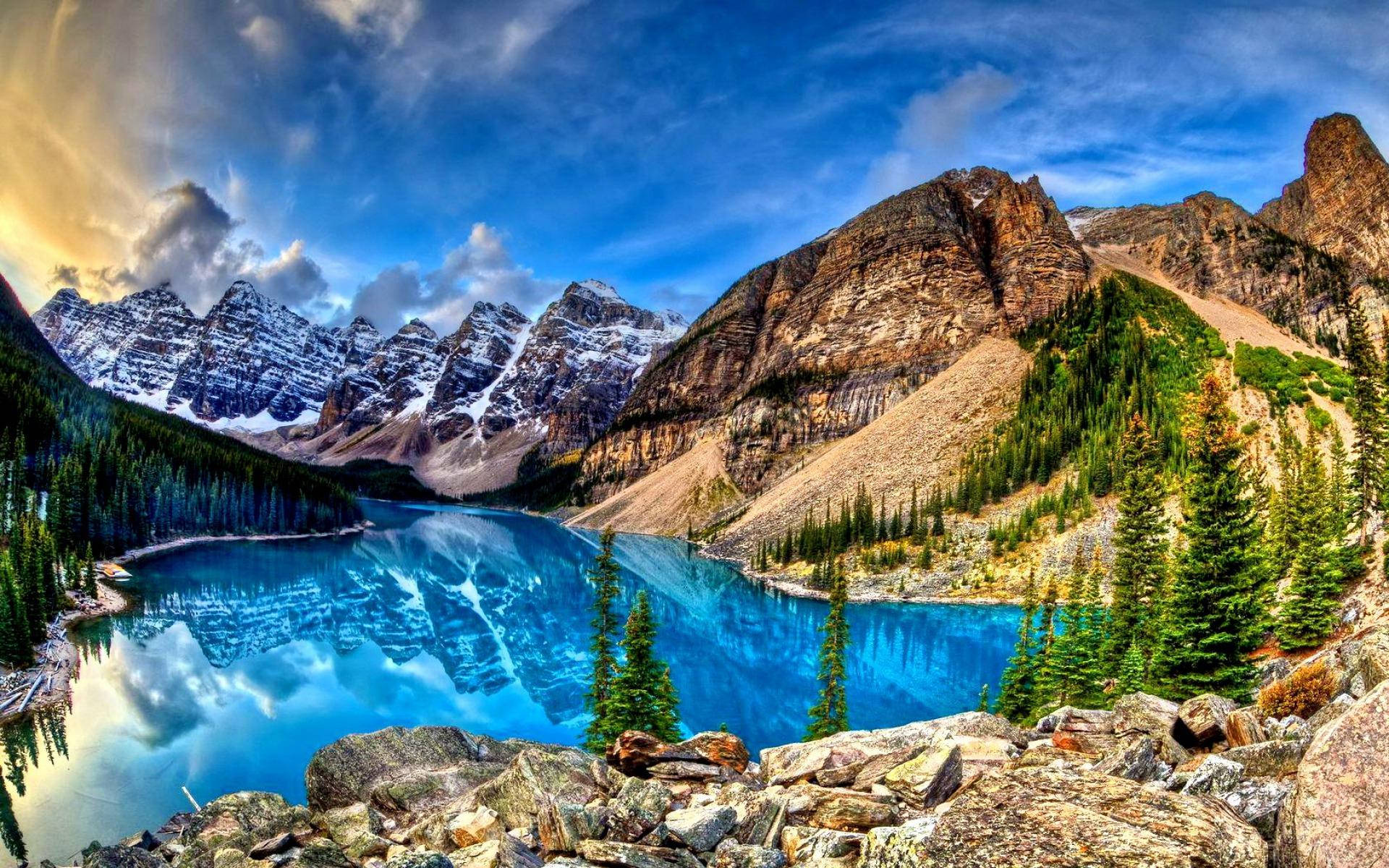 Rocky Mountain With Reflective Blue Lake Background