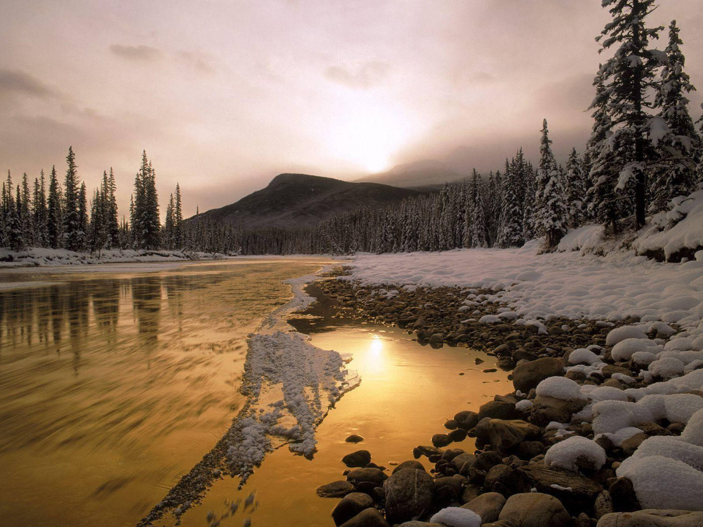 Rocky Mountain With Snow-covered Rocks Surrounding Lake Background