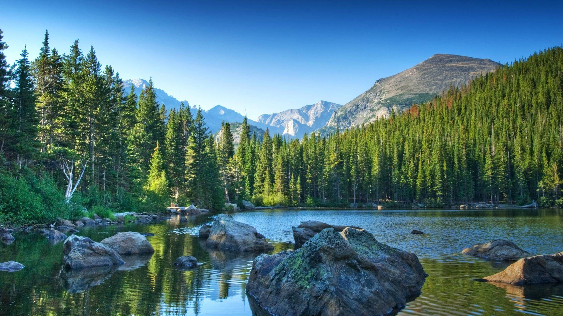 Rocky Mountain With Stone-filled Lake