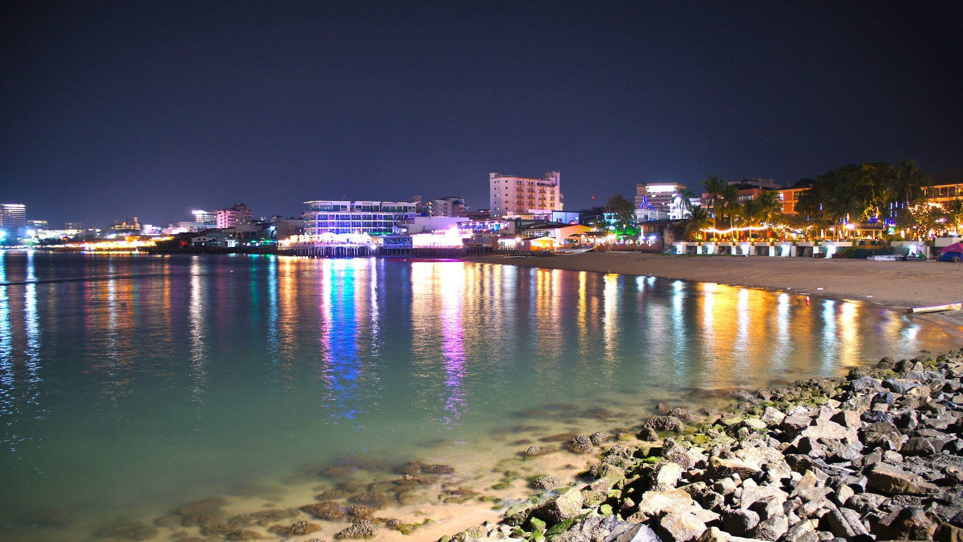 Rocky Pattaya Shore At Night Background