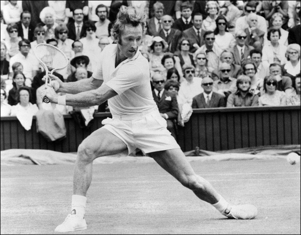 Rod Laver In Full Swing At 1962 Wimbledon Tournament Background