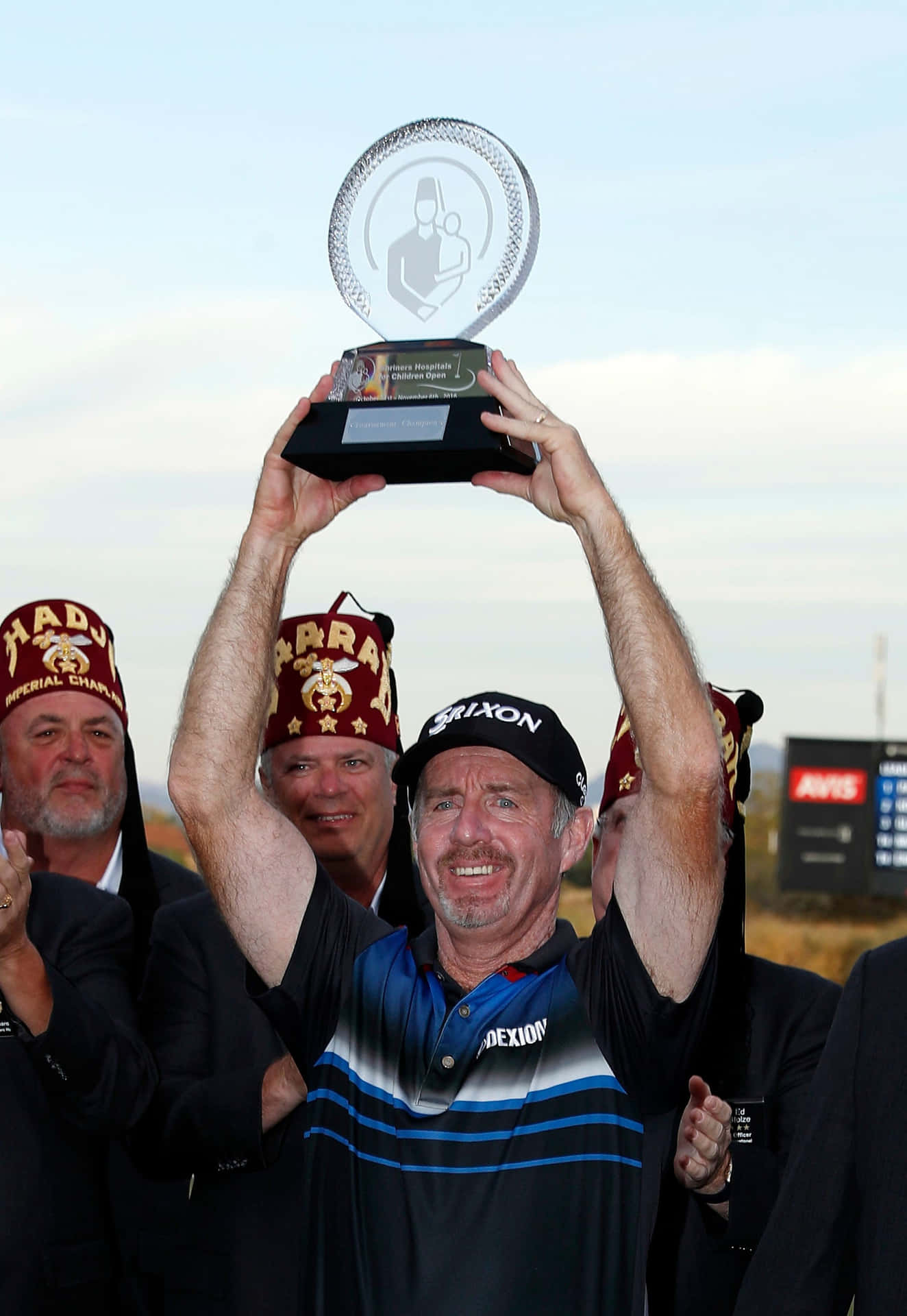 Rod Pampling Carrying Trophy In Air Background