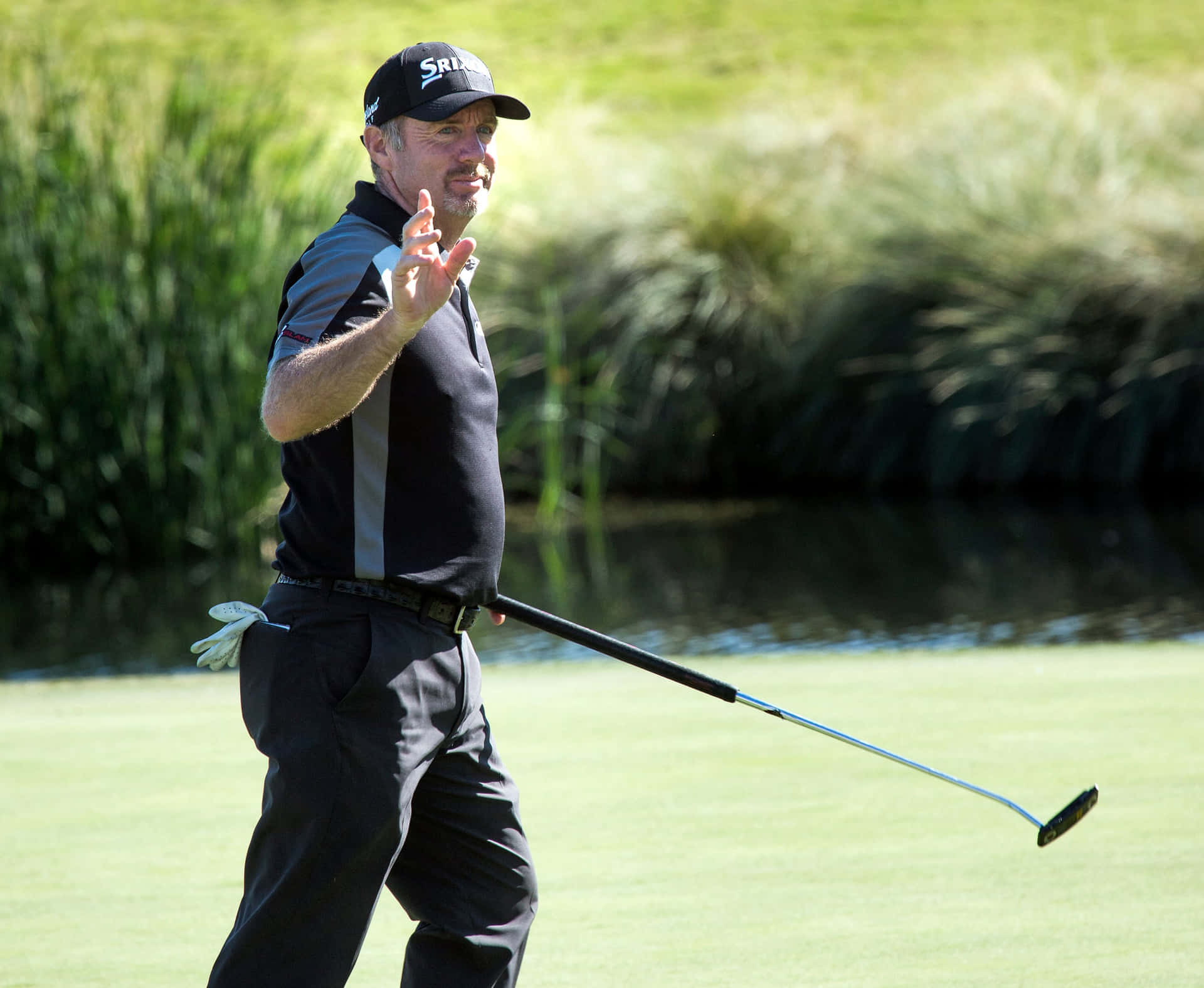 Rod Pampling Enjoying A Successful Day On The Golf Course Background