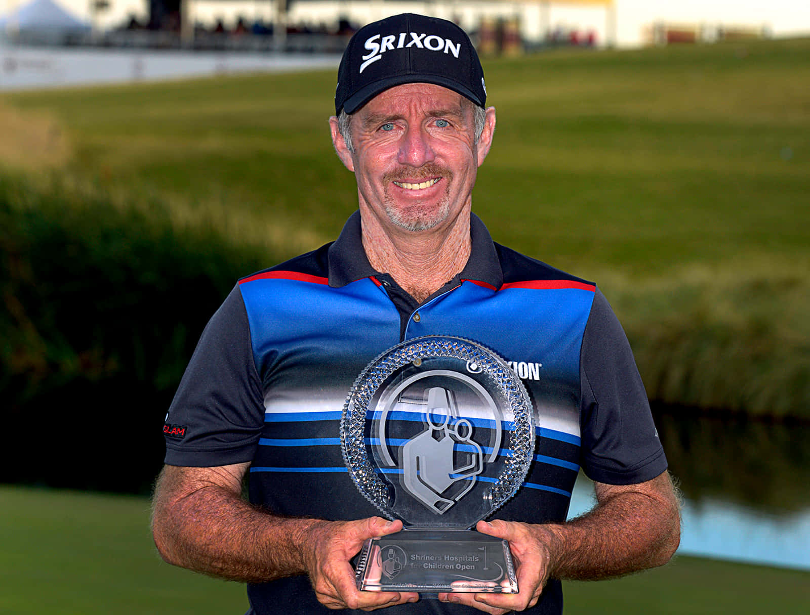 Rod Pampling Holding A Trophy Background
