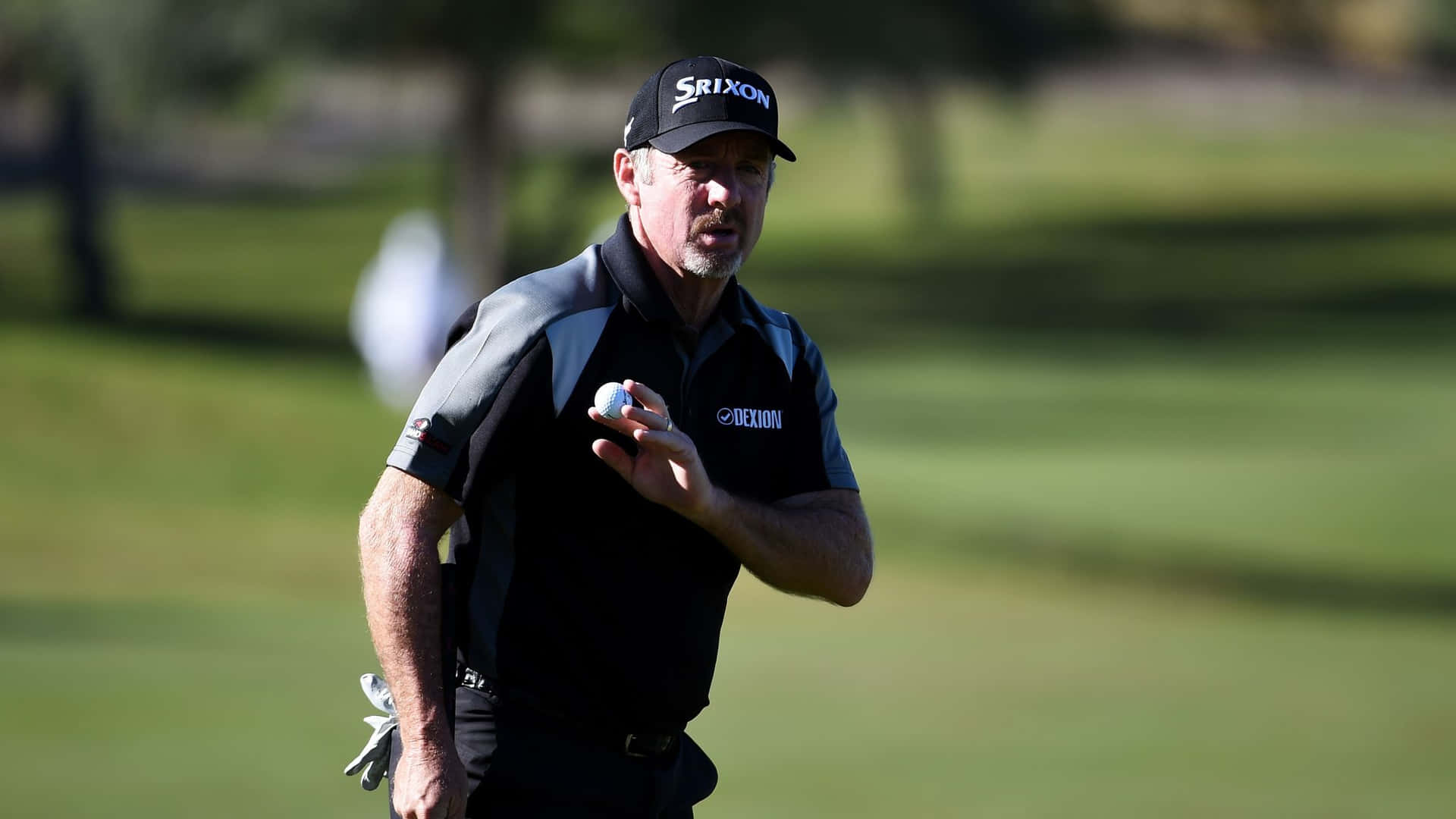 Rod Pampling Holding Golf Ball Background