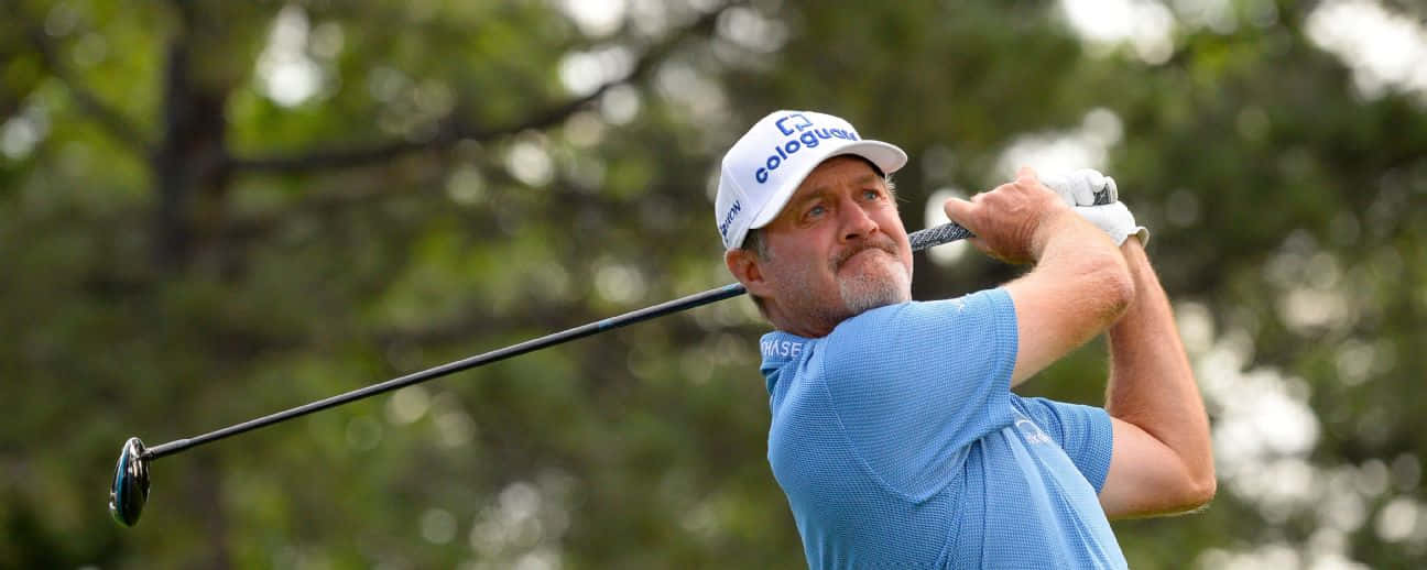 Rod Pampling Holding Up Club Background