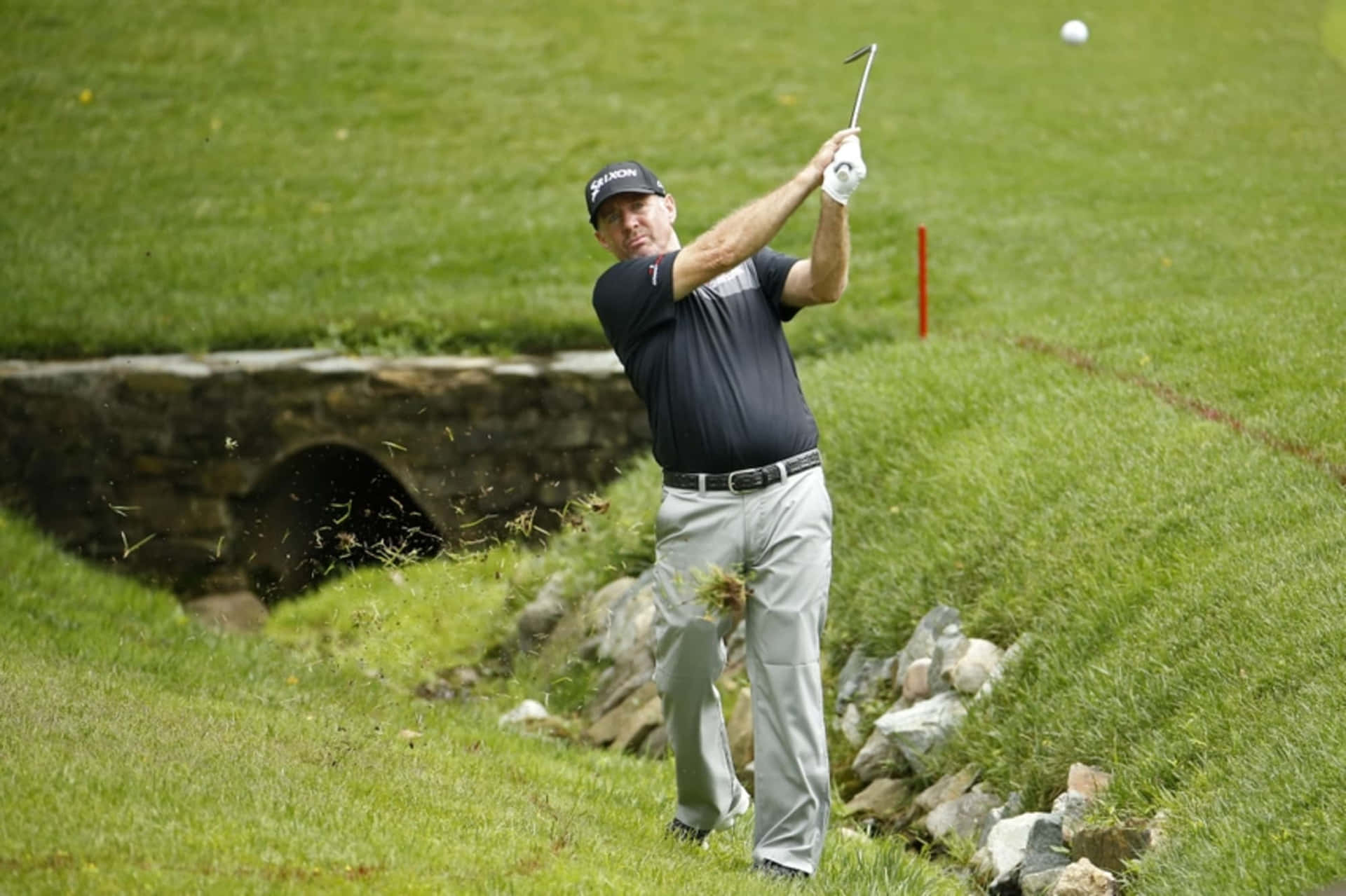 Rod Pampling On Golf Course Terrain Background