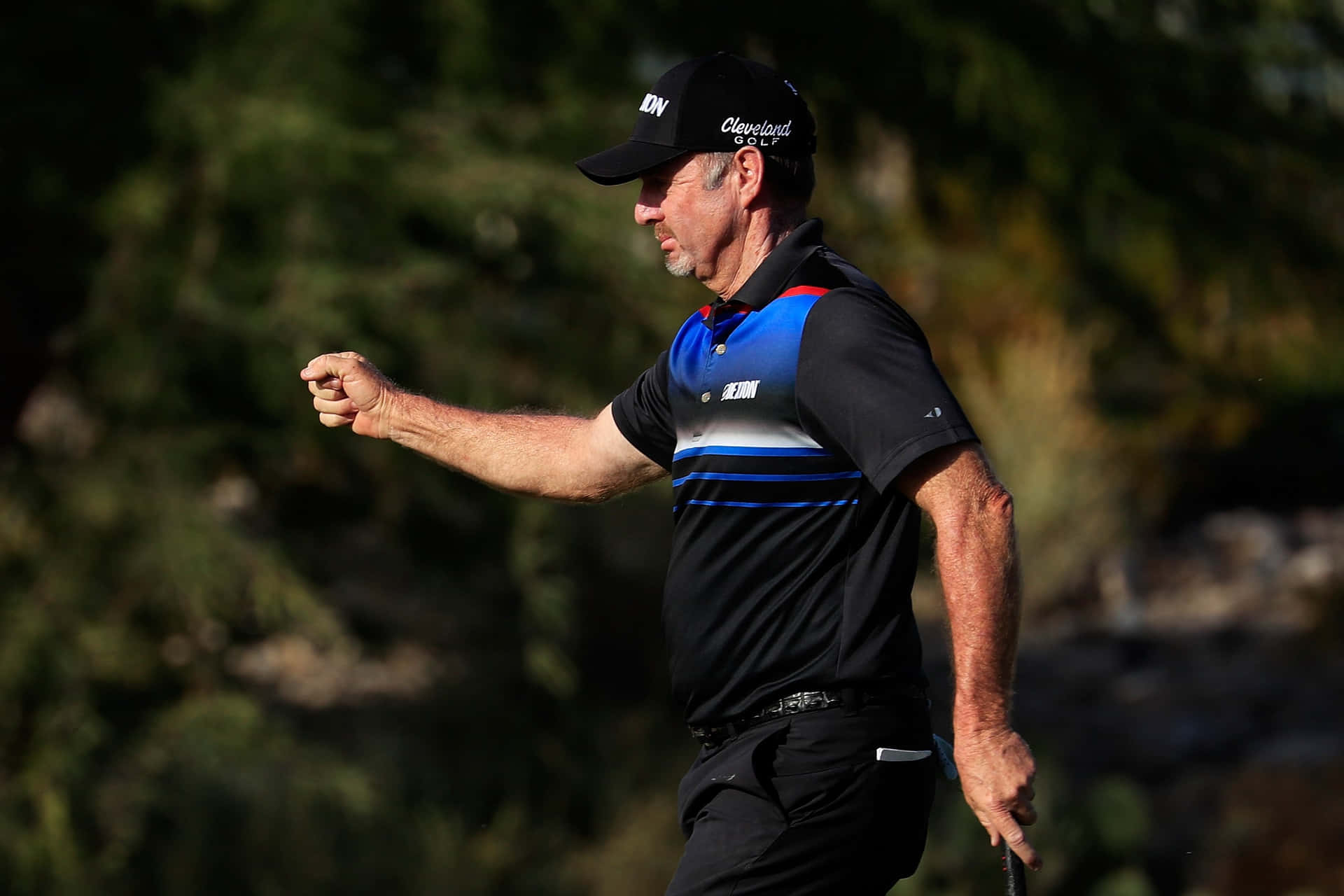 Rod Pampling Triumphantly Raising His Fist Background