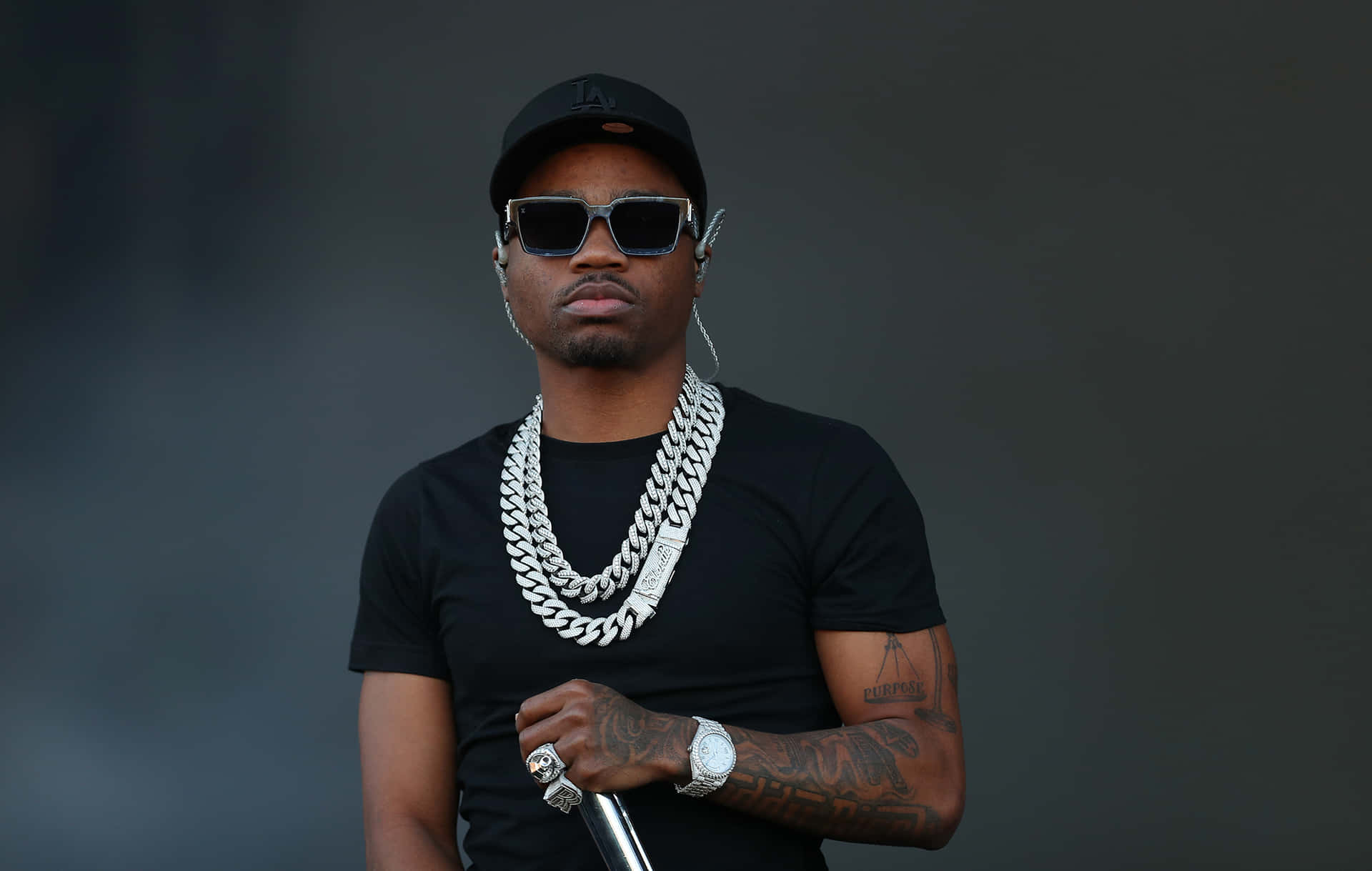 Roddy Ricch Strikes A Pose During An Outdoor Photo Shoot. Background