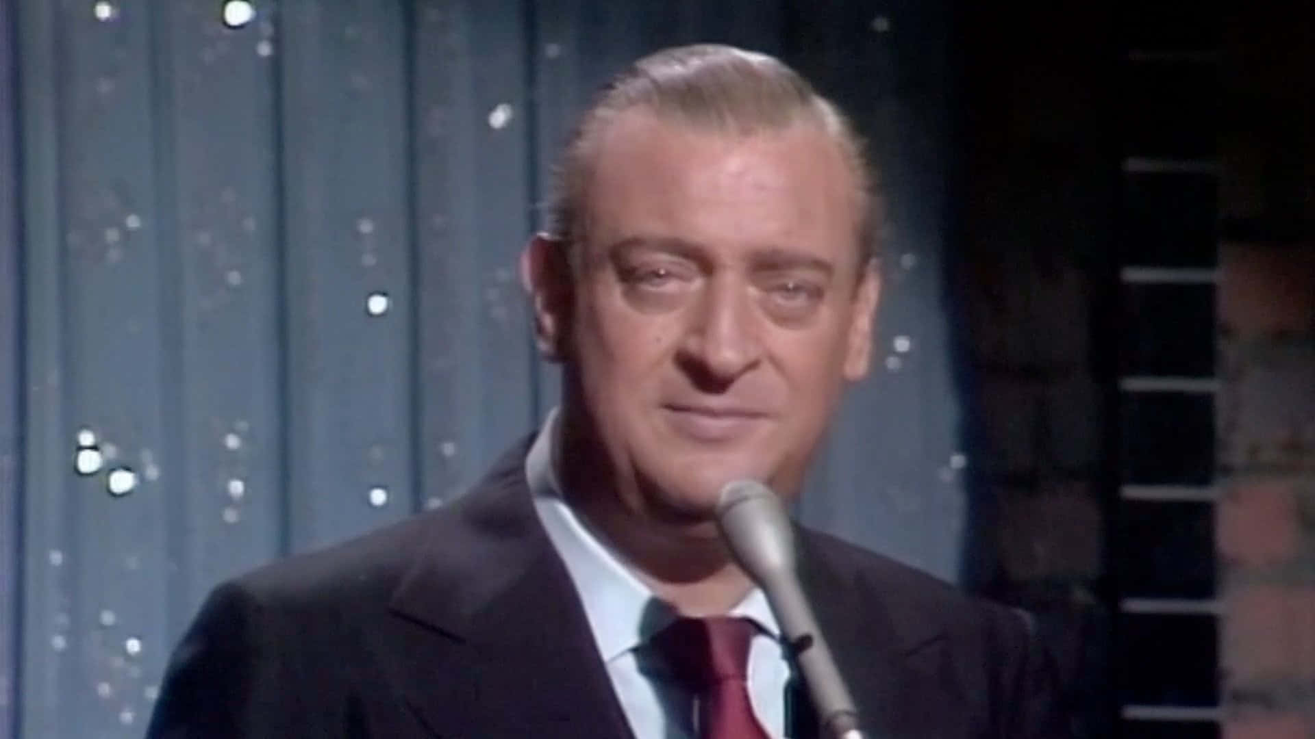 Rodney Dangerfield Stand Up Comedian On Stage Background