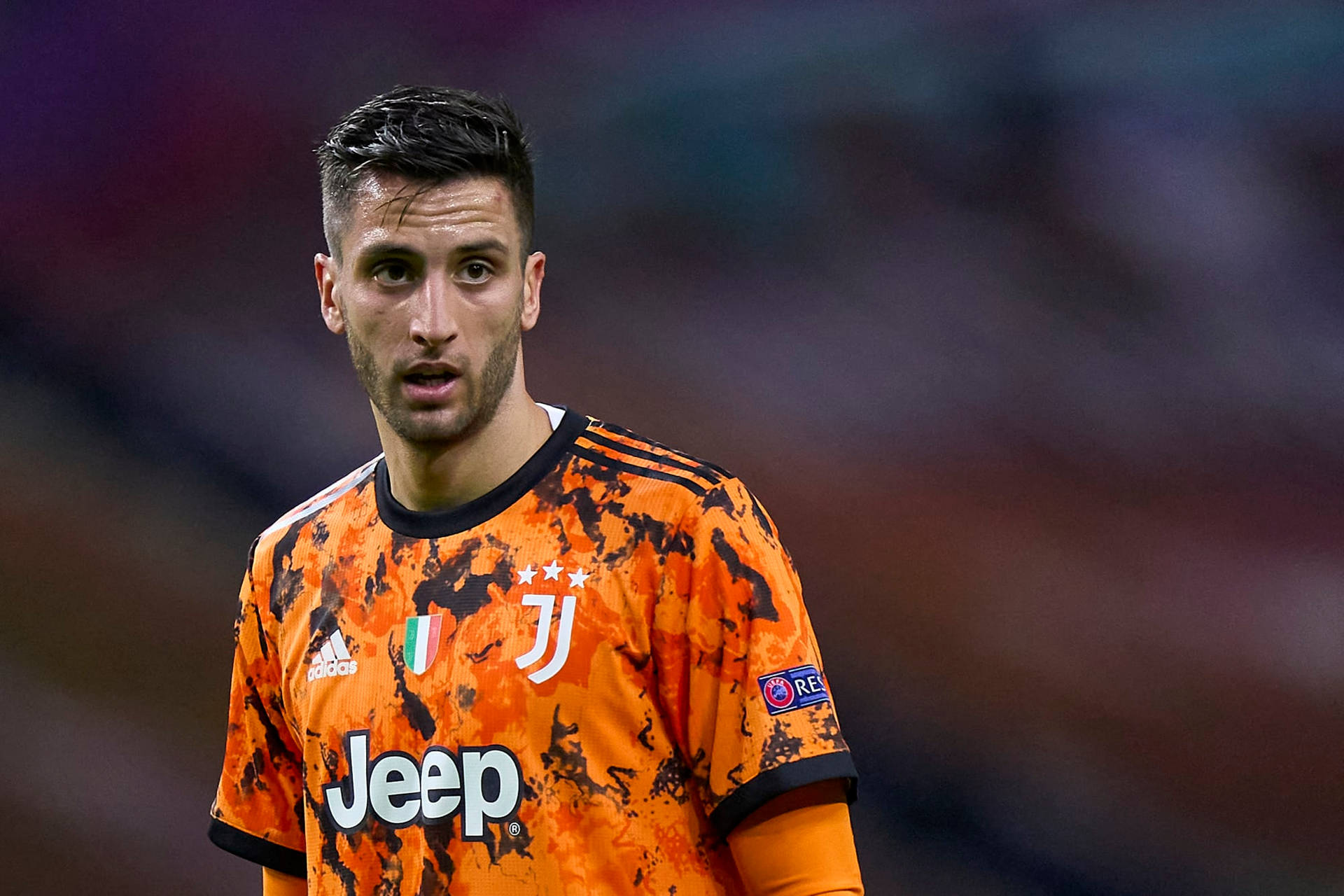 Rodrigo Bentancur Sporting His Orange Juventus Jersey