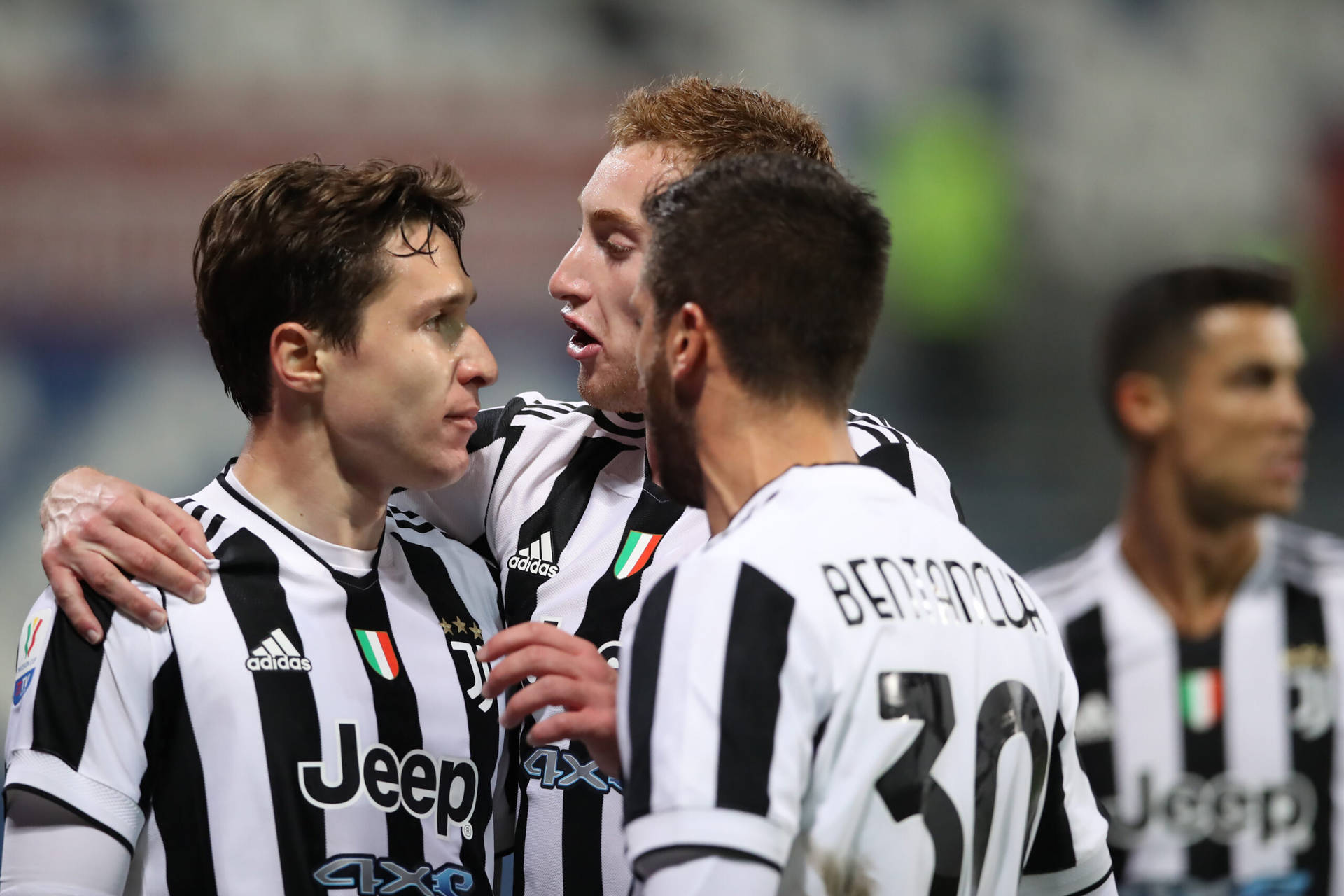 Rodrigo Bentancur With Juventus Teammates Background