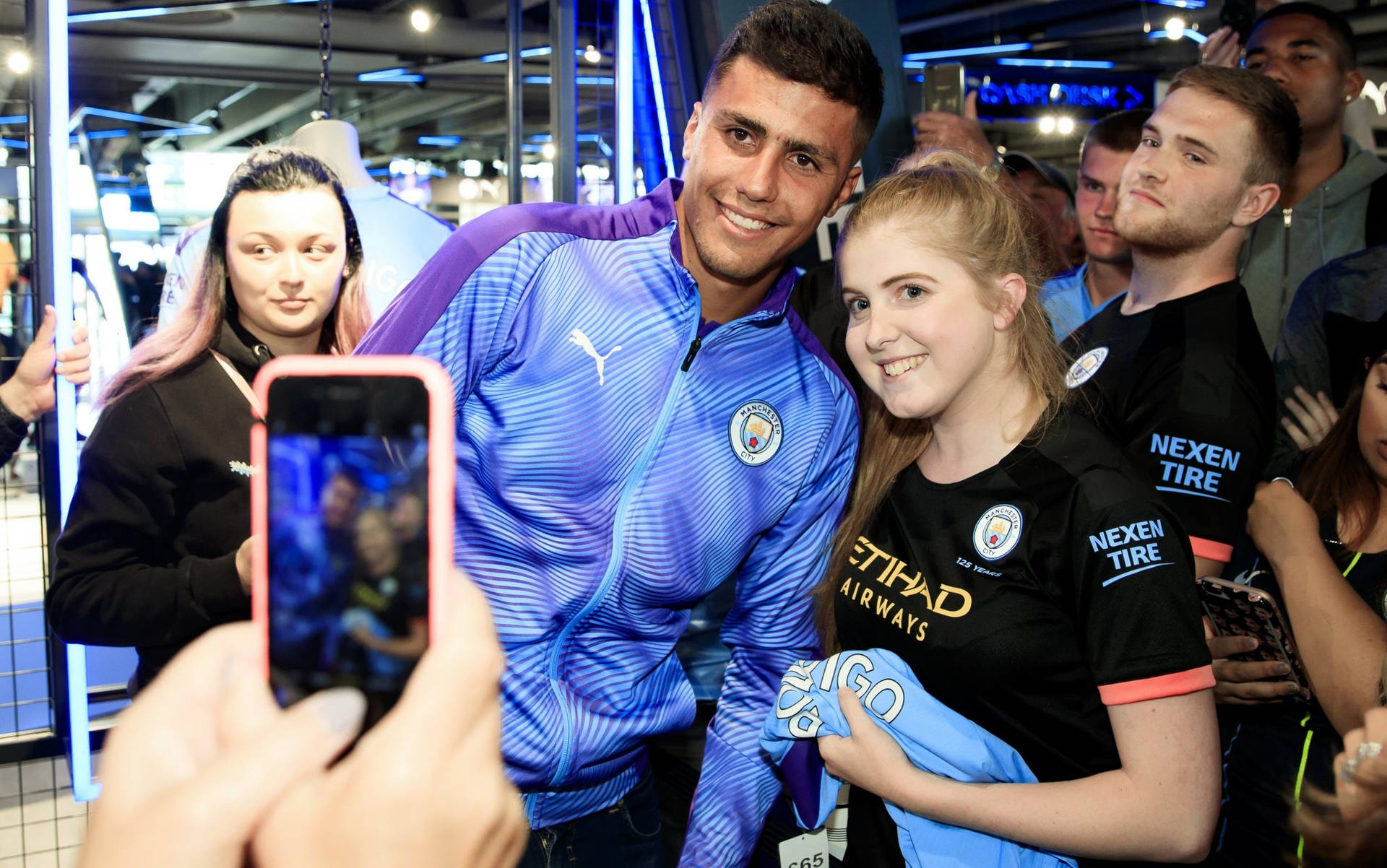 Rodrigo Hernández Cascante Taking Photo With Fan