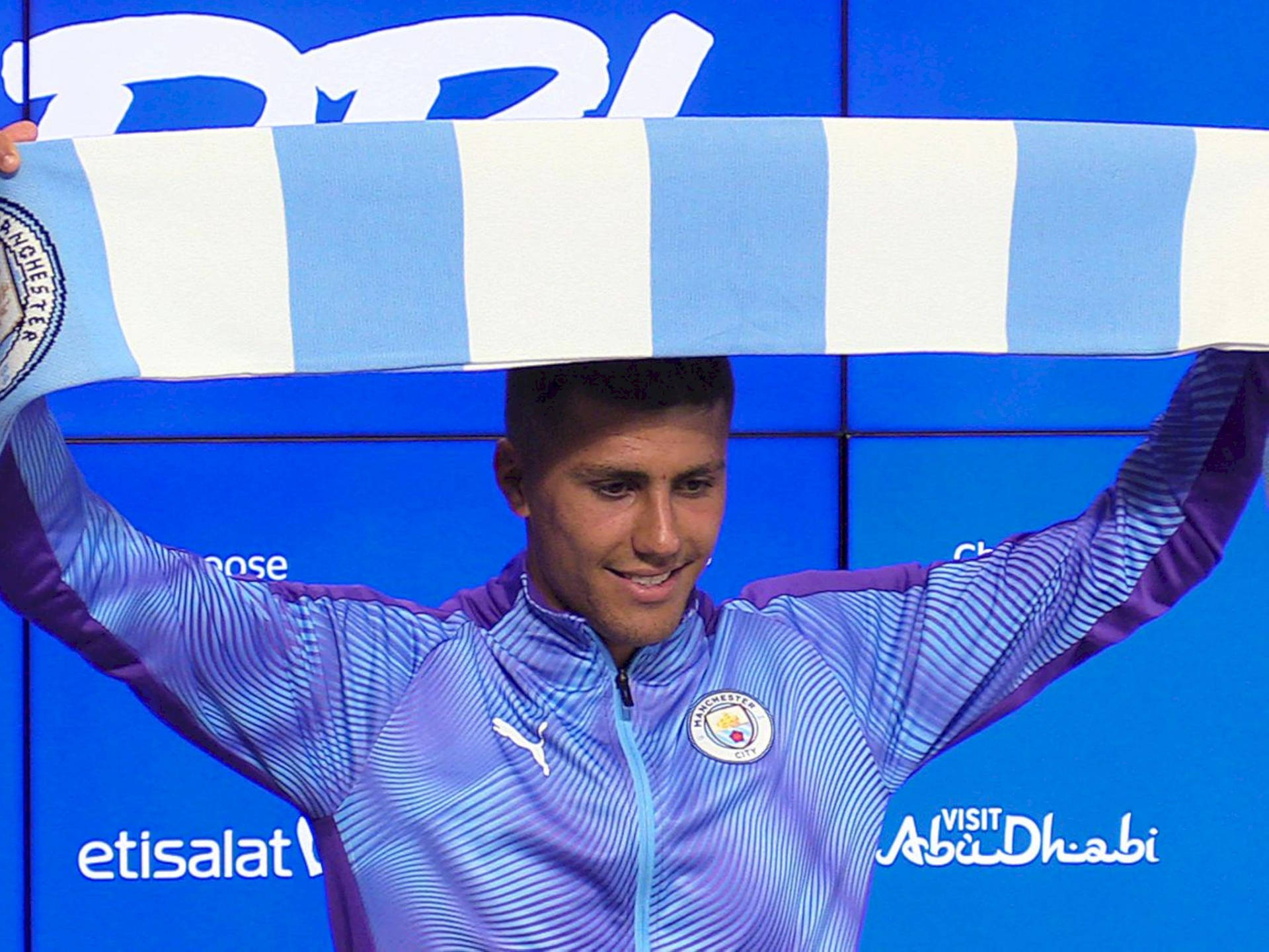 Rodrigo Hernández Cascante With Mancity Banner Background