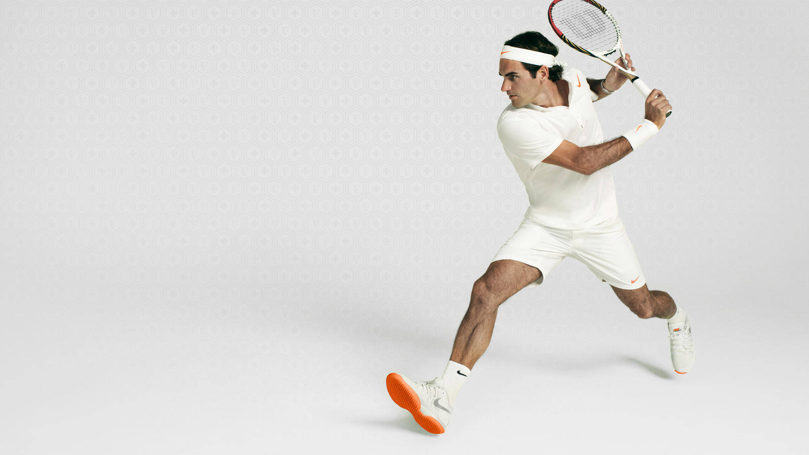 Roger Federer Showcasing His Agility On The Tennis Court. Background