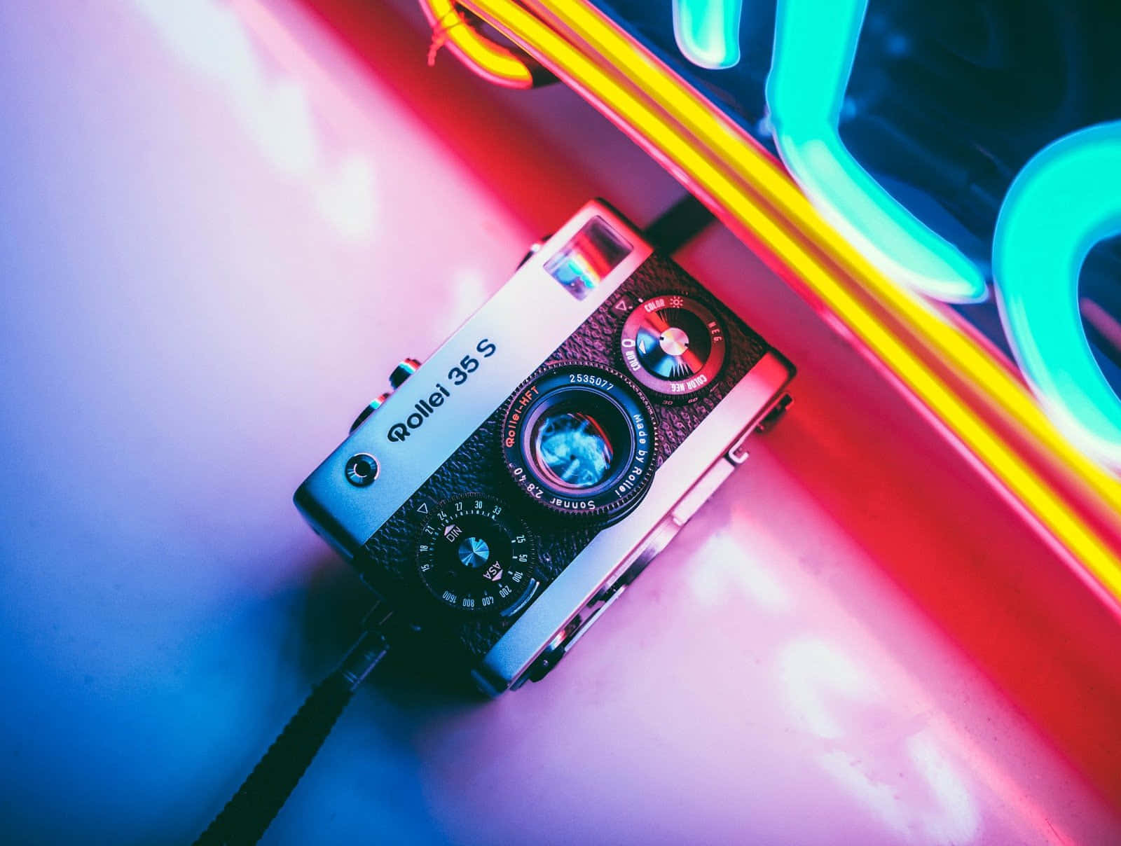 Rollei Photography Camera On Neon Light Background