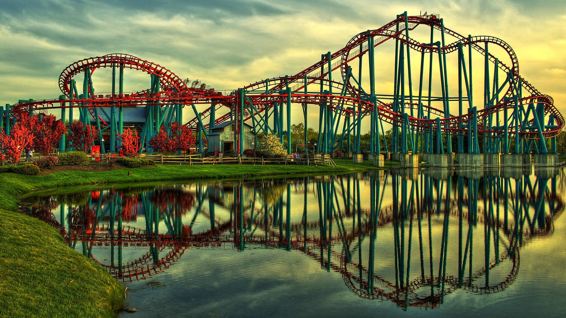 Roller Coaster Mirroring Water Reflection Background