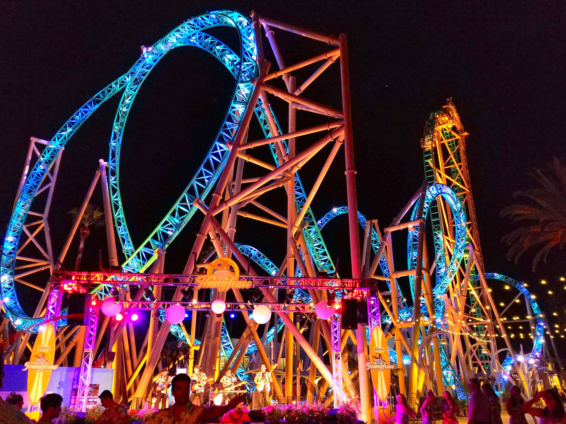 Roller Coaster Ride In Neon Lights Background