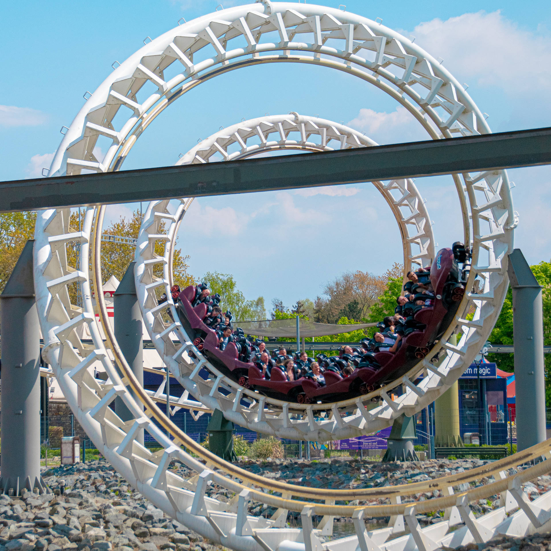Roller Coaster With Spiral Railway Background