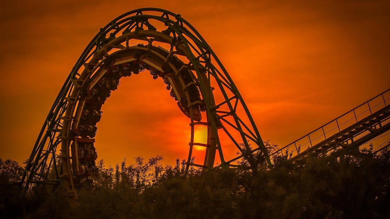 Roller Coaster With Sunset Clouds Background